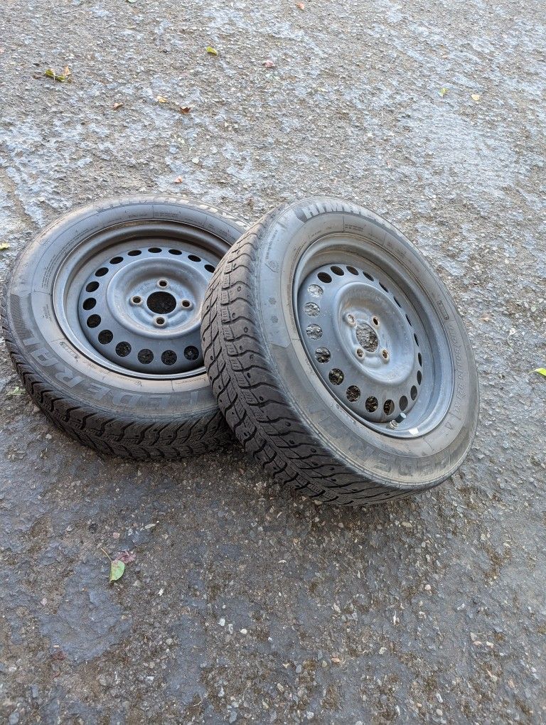 4x100 steelie wheels with used snow tires.