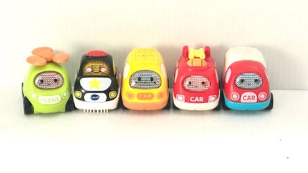 Go! Go! Smart Wheels electronic toy vehicles, including a police car, fire truck, and helicopter