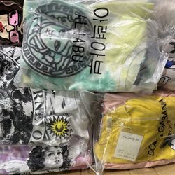 over 50 random t-shirts on sale for only $150
