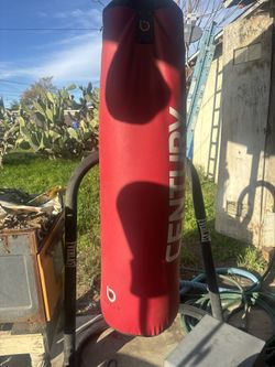 Punching Bag And Stand With A Bench