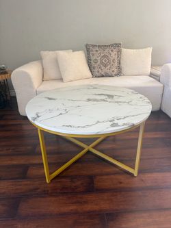 Faux white marble top coffee table with gold legs