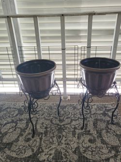 2 metal stands for plants  with pots