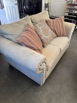 Beige Fabric Loveseat with Nailhead Trim