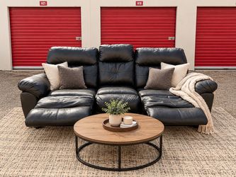Black Pleather Reclining Sofa – $180