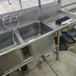 Commercial-grade stainless steel double sink $550with faucet.Located Mount Dora Fla 32757