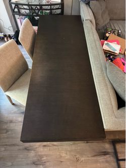 Modern wood table and two matching chairs