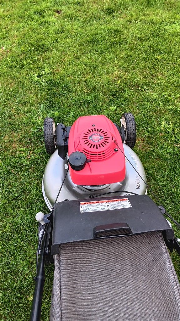 Honda lawn mower in like new condition works as it should 325. for