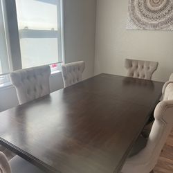 Dining table w/6 Tufted chairs.