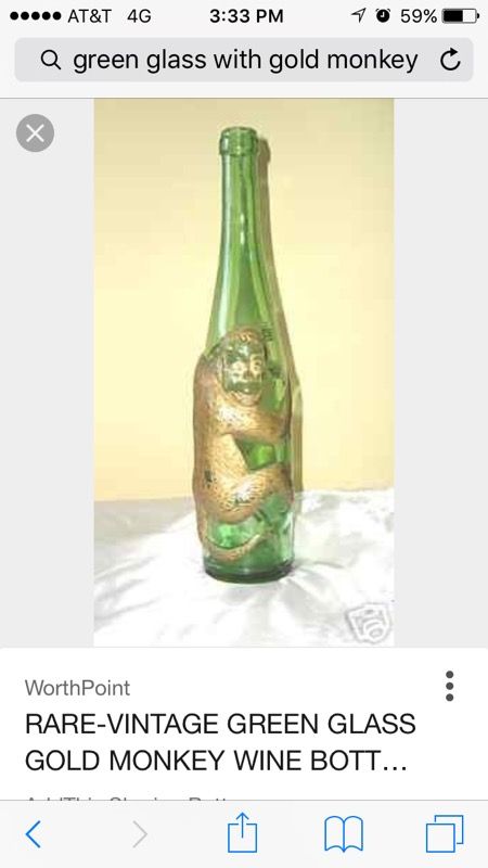 Vintage German Green wine bottle with gold monkey