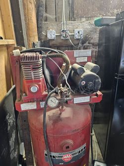Mac Tools air compressor tank with a 5 HP motor rating and a 44- gallon capacity