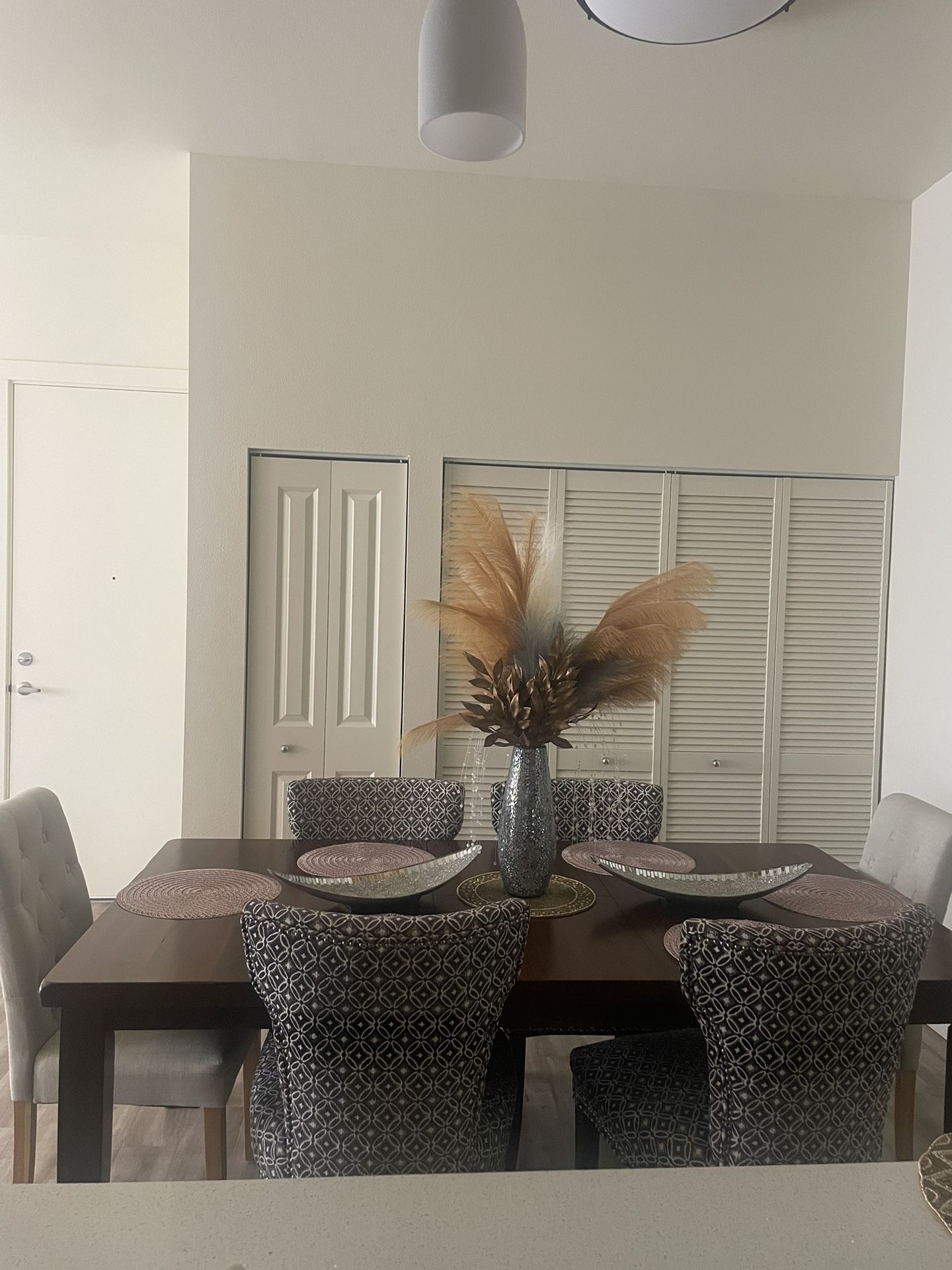 Dining table and chairs sit six