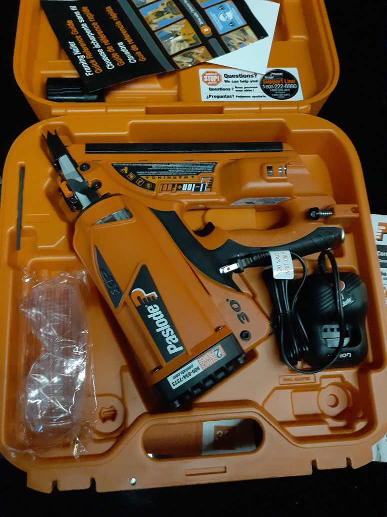 Paslode cordless nail gun with battery and charger
