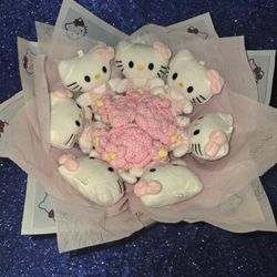 small Hello Kitty plush toys arranged like a bouquet of flowers with pink crochet "flowers" in the center. 