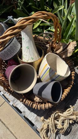 Basket of small ceramic pots