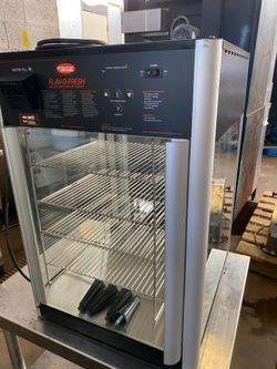 Holding and display cabinet