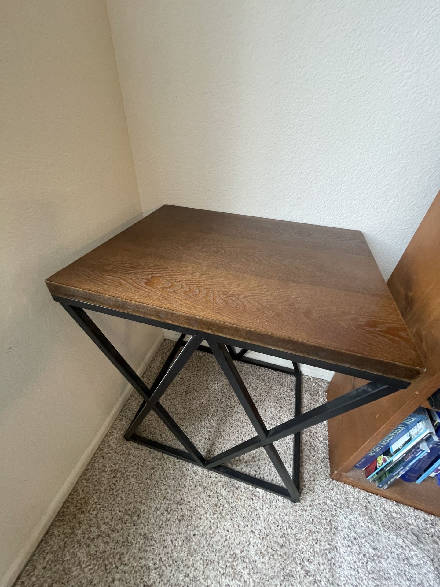 Wooden side table with black metal frame