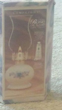 Rose oil lamp never used. In box.