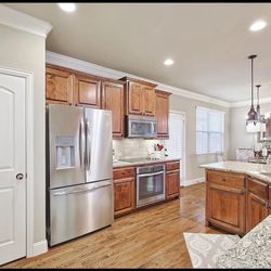 Cabinets, Granite, Microwave, Cooktop, Dishwasher, And Oven 