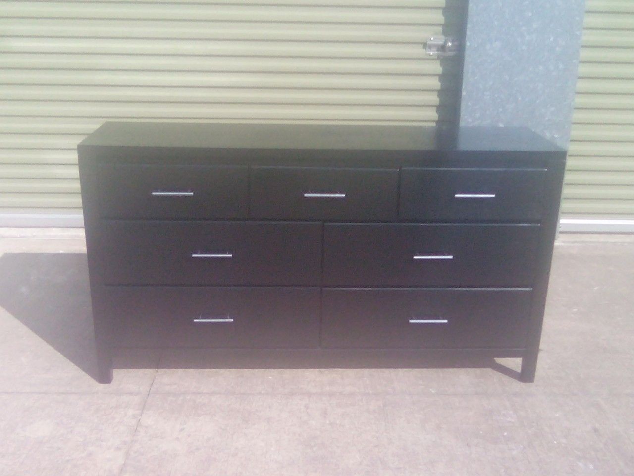 Gloss black Dresser in good condition drawers fuction well it's wood with slot of life
