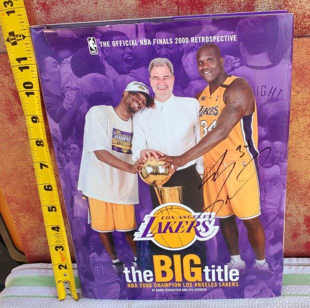 Signed x2 by Shaquille O'Neal.

"The Big Title" NBA 2000 Champion Los Angeles Lakers Finals Retrospective Book - 111 Pages