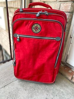 Kipling 22" Expandable Wheeled Red Rolling Carry On Travel Luggage   Preowned condition  Kindly check the pictures below for the condition of the item