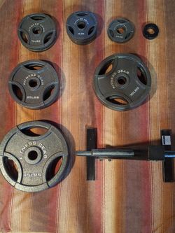 300 lbs olympic weights with barbell and stand