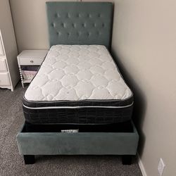 Upholstered Twin bed with tufted headboard in like new condition
