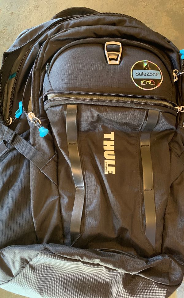 BRAND NEW! THULE Sweden backpack! With sunglasses case, 4 pockets, and