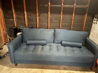 Blue couch four pillows