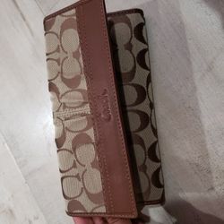 Slightly used brown Coach wallet