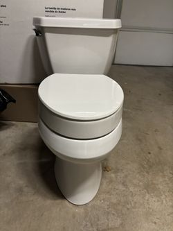 Used Toilet By Kohler With Added Height