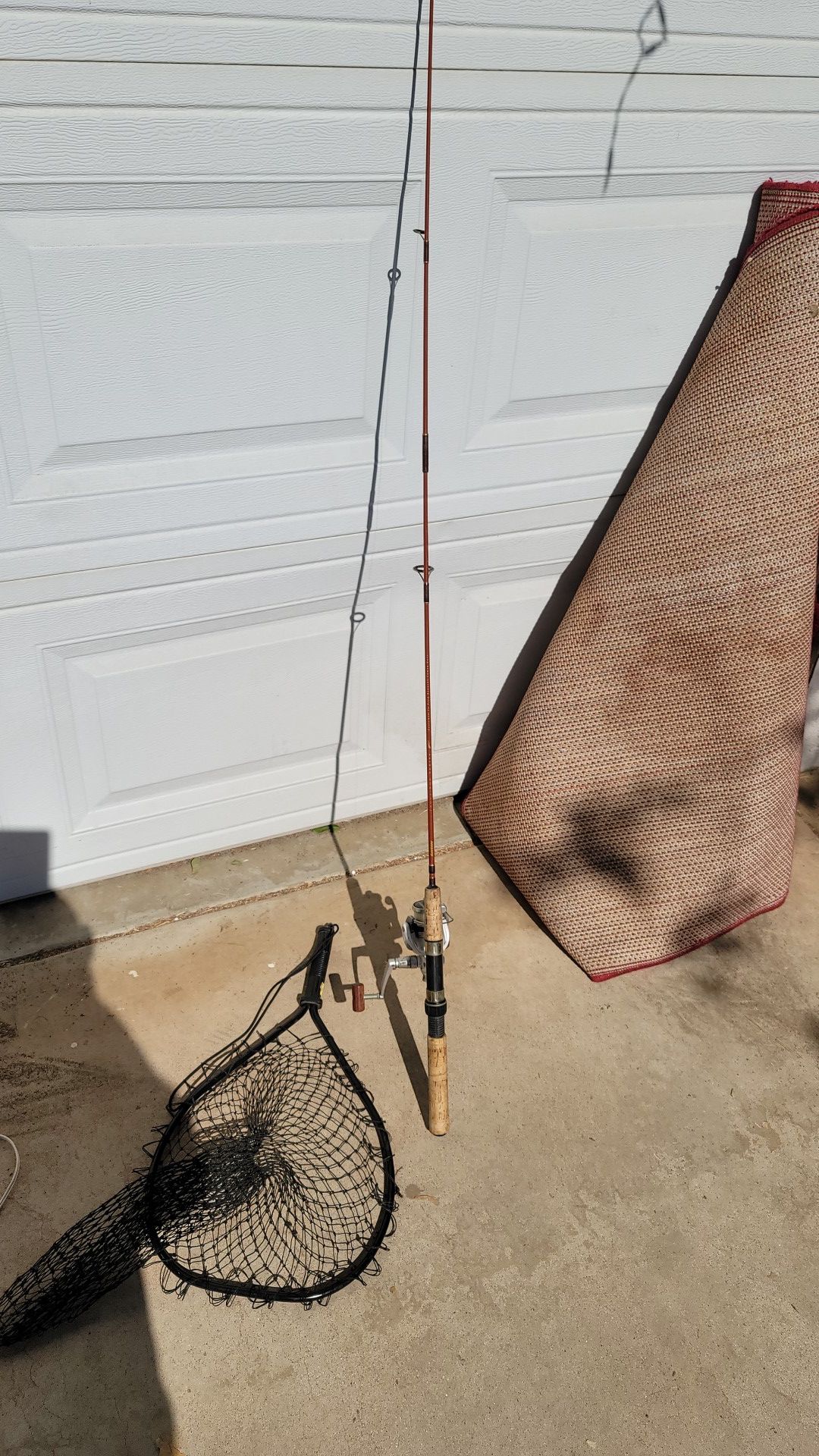 Shimano 1000 fishing pole. Berkley rod and net
