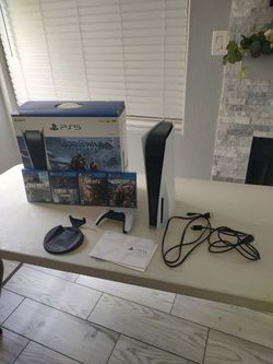 Open box PS5 with games
