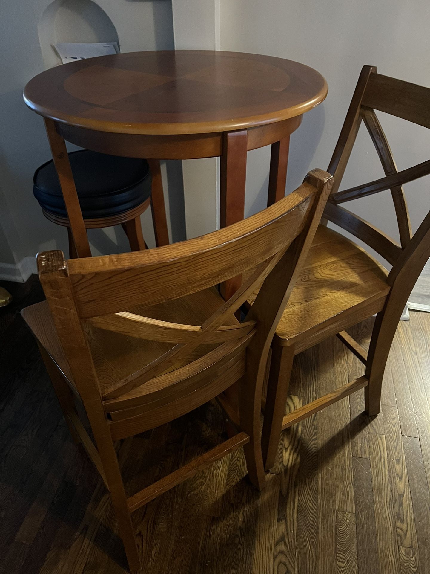 Round Table With Stool And Two Tall Wooden Chairs