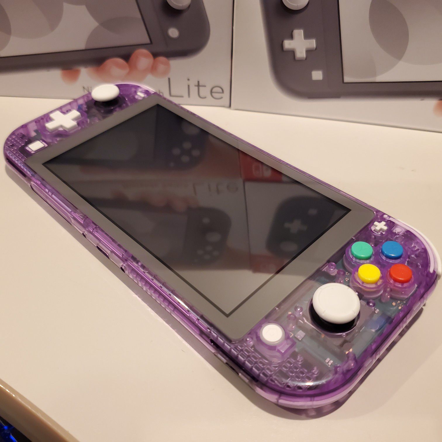 Custom Nintndo switch lite atomic purple with famicom buttons mod