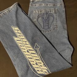 broken promises embroidered cobra jeans