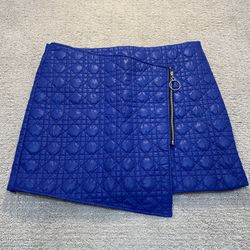 Quilted blue zip up skirt.