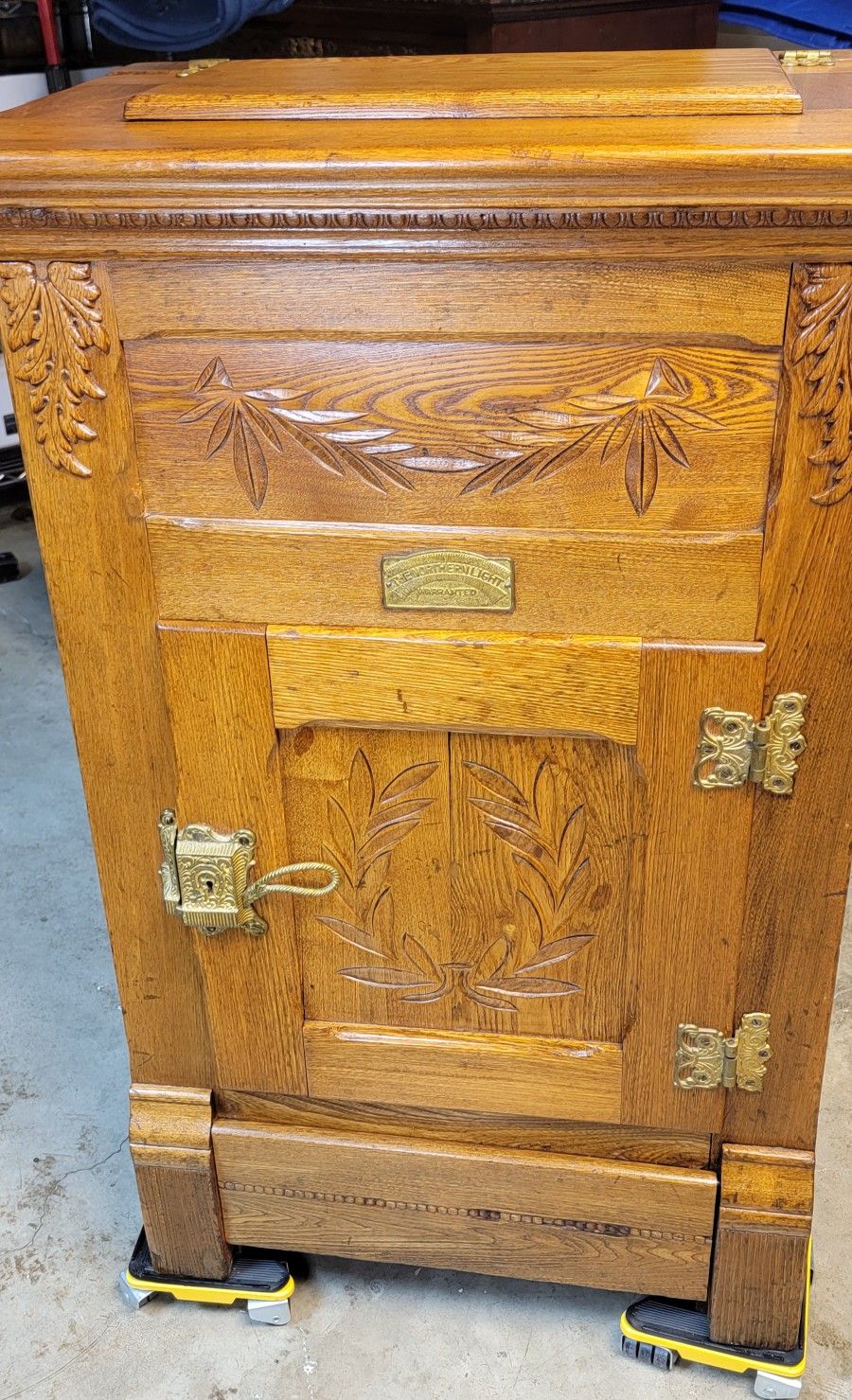 Antique icebox cabinet, manufactured by The Northern Light Company.
