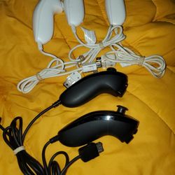 5 Wii Num Chuck's & 2 Motion Adapters $25