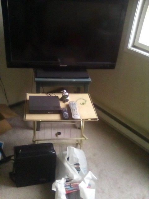 SHARP TV/ OVER 200 MOVIES AND DVDS/BOTH FOR $40