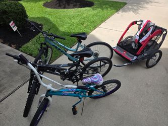 Three bicycles and a bike trailer