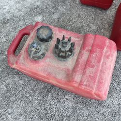 Small boat, fuel tank and miscellaneous gas cans