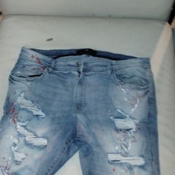 Size 44 Jordan Craig ripped jean shorts with red and white paint splatter