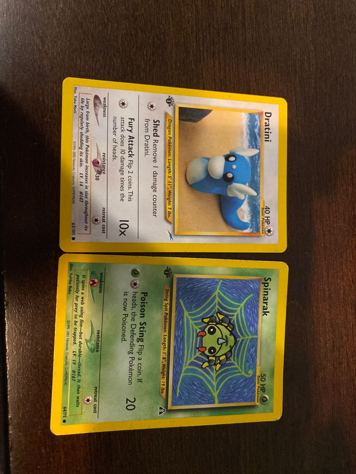 2 first addition Pokémon cards (dratini, and spinarak)