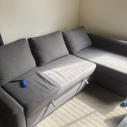 L Shaped Couch - Has Storage And Can Turn Into A Sofa Bed. No Major Defects 