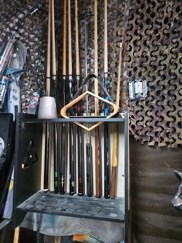 8 Pool Sticks In Very Good Condition All Stright And All Unscrew And Wall Stand And Chalk.and 9 And 8 Ball Racks. $30
