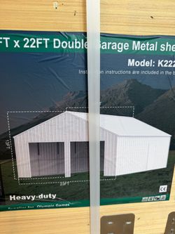 New 23’x22’ enclosed steel garage with side door