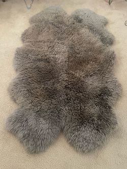 Real sheep skin about 6 feet long about 4 feet wide from new zeland