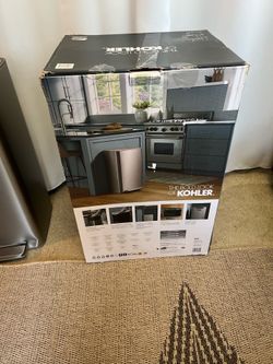 Somewhat used Kohler 47L Step Trash Can, with a few minor scratches and dents on a bottom.