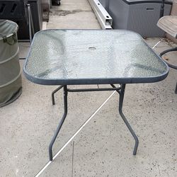 Glass dining table with umbrella hole